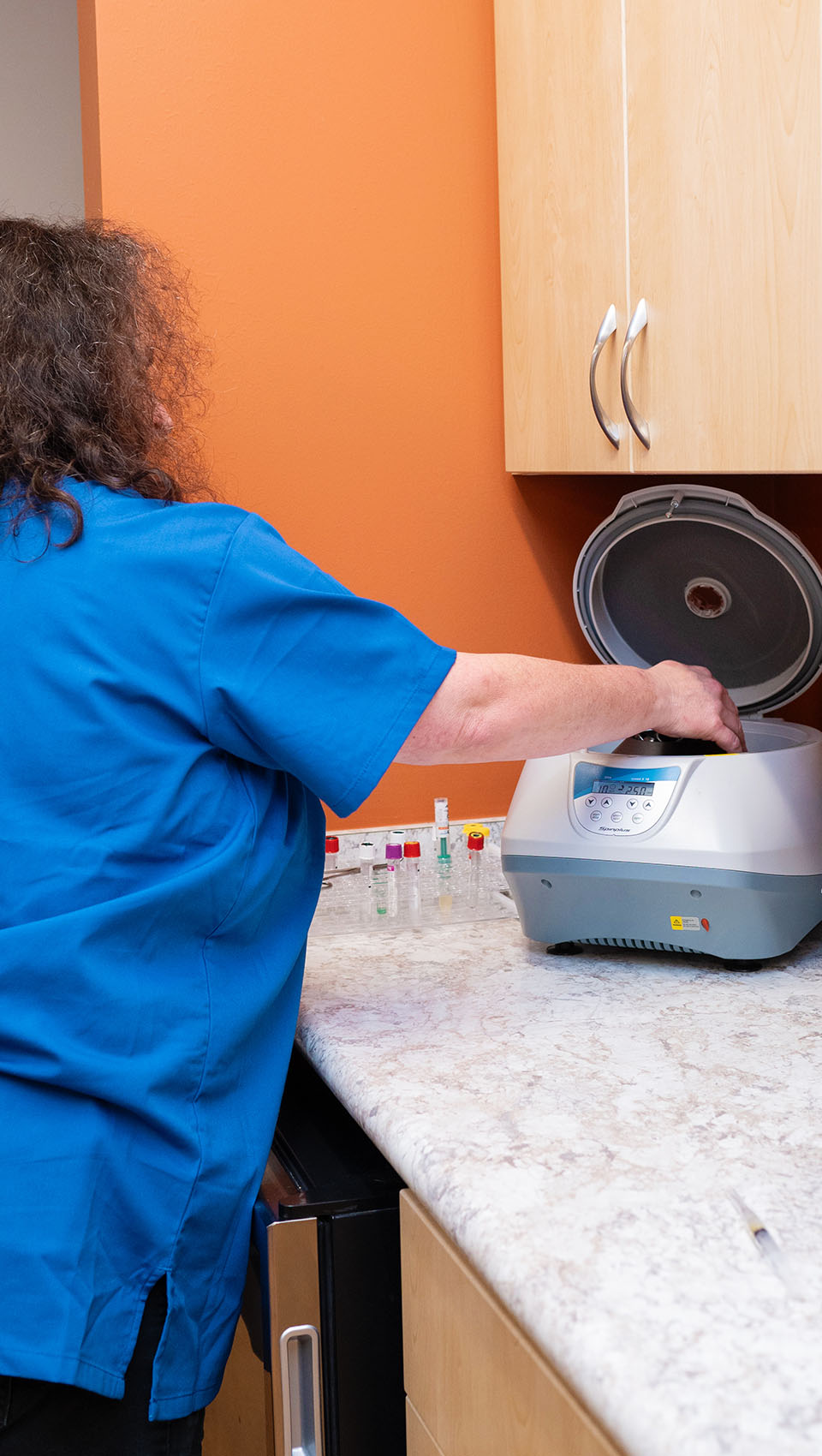 Dr. Matagrano using a centrifuge